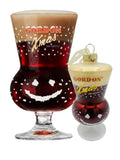 Gordon Xmas Ale beer glass shown beside the matching Christmas bauble