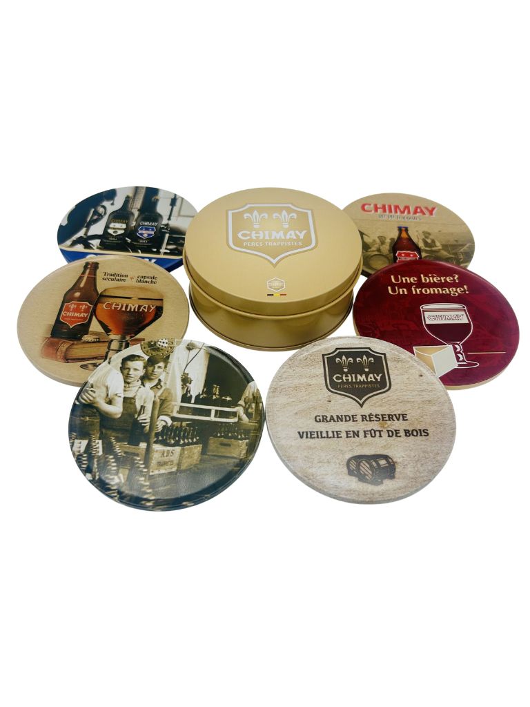 Six assorted round Chimay drinks coasters with a matching branded storage tin